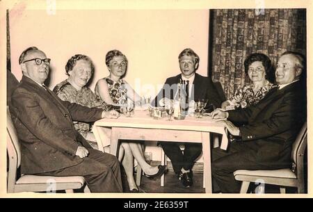 GERMANY - CIRCA 1970s: Retro photo shows social event - celebrating of New Year's Eve. Circa 1970s. Black and white photo Stock Photo