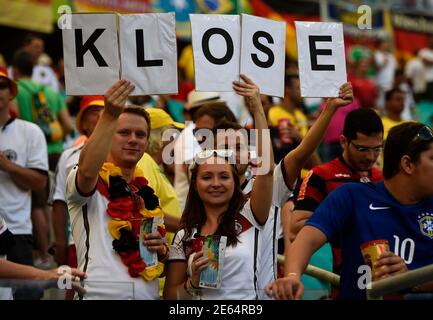 German fans hold up signs spelling out the name of Germany's Miroslav Klose before their 2014 World Cup Group G soccer match against Portugal at the Fonte Nova arena in Salvador, June 16, 2014. REUTERS/Dylan Martinez (BRAZIL  - Tags: SOCCER SPORT WORLD CUP)
