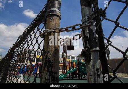A playground is seen behind a locked gate at Woods Elementary Math & Science Academy in Chicago, Illinois, United States, May 8, 2015. Forty-nine elementary schools were targeted by the country's largest mass closing in 2013, and most are still empty two years later. Under-enrollment and low resources were cited by school board officials for the closures, which mainly affected poorer African-American and Latino neighborhoods. The shuttered buildings have become a vivid symbol of the fight over Chicago Mayor Rahm Emanuel's sweeping drive to reform education and tackle a projected $1.1 billion e