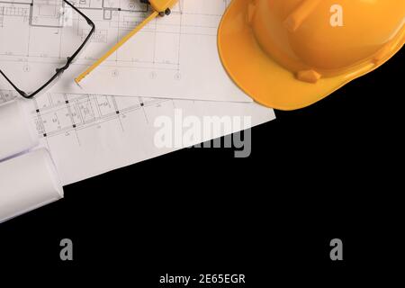 Top view, architect's office desk with construction drawings. Stock Photo
