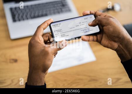 Remote Check Deposit Using Mobile Remote. Taking Photo Stock Photo