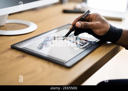 African American Man Using Graphic Tablet Painting On Screen Stock Photo