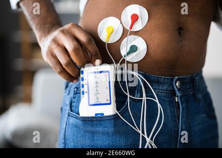 African American Patient Using Electrodes Diagnostic Device Stock Photo