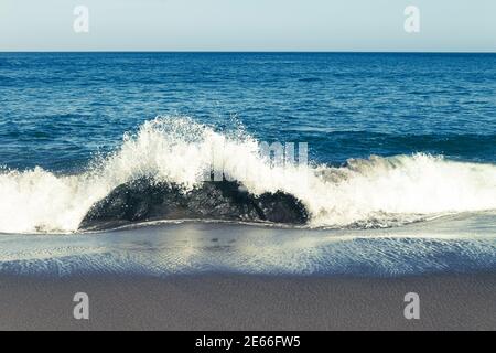 Atlantic ocean, strong waves, splashing, breaking on coast, rocks, volcanic island, Azores. Stock Photo
