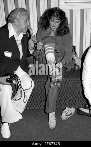 Pam Dawber of TV show Morkand Mindy being interviewed while putting on rollerskaes at Flippers, 1978 Stock Photo