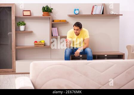 Young student boring at home during pandemic Stock Photo