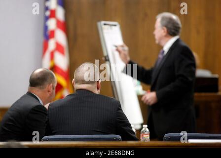 Former Marine Eddie Ray Routh (2nd L) watches as his court appointed attorney Tim Moore writes out a timeline during opening statements during his capital murder trial at the Erath County Donald R. Jones Justice Center in Stephenville, Texas February 11, 2015. Routh, 27, is charged with murdering Navy SEAL Chris Kyle, who was credited with the most kills of any U.S. sniper, and Kyle's friend Chad Littlefield in 2013. REUTERS/ Tom Fox/Pool (UNITED STATES - Tags: CRIME LAW MILITARY)