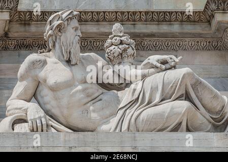 Sculptures of Roman at the Neptune Triumphal Arch called Arch of Peace (Porta Sempione) in Milan historical downtown, Sempione Park, Italy.
