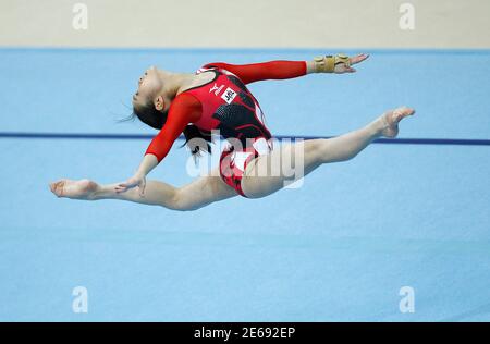 Koko Tsurumi of Japan performs on the floor during the women's team final of the Artistic Gymnastics World Championships in Rotterdam October 20, 2010. REUTERS/Jerry Lampen (NETHERLANDS - Tags: SPORT GYMNASTICS)