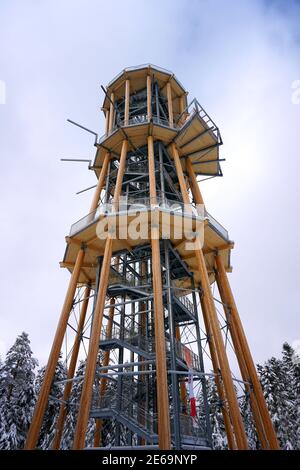 Low angle shot of a yellow tower with three different floors Stock Photo