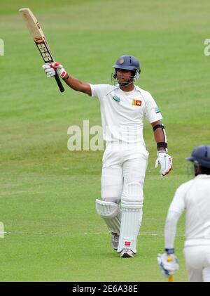 Sri Lanka's Dinesh Chandimal celebrates scoring a half century during the third day of their second cricket test match against South Africa in Durban December 28, 2011. REUTERS/Rogan Ward (SOUTH AFRICA - Tags: SPORT CRICKET)