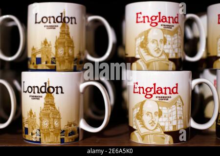 Branded coffee mugs are displayed on a shelf in Starbucks' Mayfair Vigo Street branch in central London September 12, 2012. Picture taken September 12, 2012.  To match Special Report BRITAIN-STARBUCKS/TAX    REUTERS/Andrew Winning (BRITAIN - Tags: BUSINESS)
