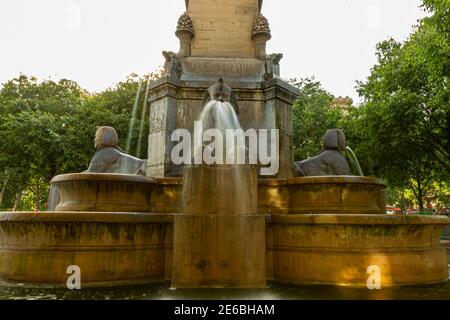 Fontaine du Palmier (Fountain of the palm) placed in the historic square Place du Chatelet in Paris. The water pours through the mouths of three Egypt Stock Photo