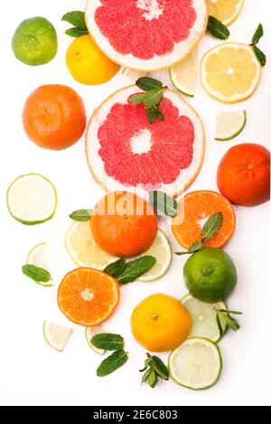Citrus background. Fresh citrus fruits - Lemons, oranges, limes, grapefruits On wooden background Stock Photo