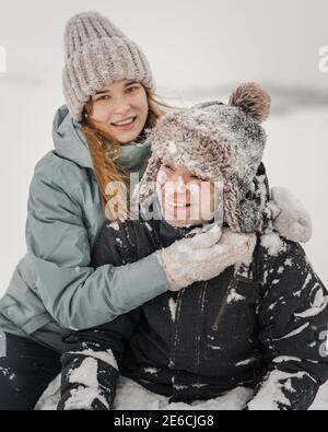 Portrait of smiling couple in love. Young happy couple walking in winter Stock Photo