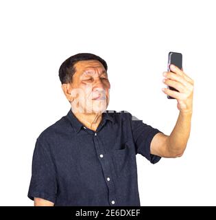 Senior man having video call from smart phone isolated on white background with clipping path Stock Photo