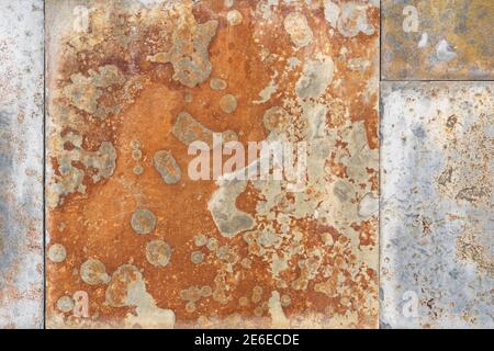 Rusty mottled peeling corroded texture. Abstract background Stock Photo