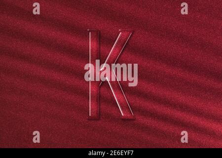 Kappa sign. Kappa letter, Greek alphabet Symbol, red background Stock Photo