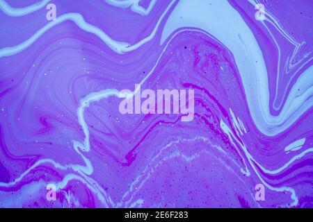 Fluid art texture. Closeup abstract violet, white and grey colors mixing of acrylic for use as background. Liquid acrylic artwork that flows and splas Stock Photo