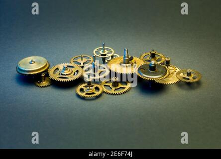 Mechanical collage made of clockwork gears on paper background Stock Photo