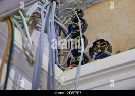 Electrician refitting and testing a new fuse board and safety checking wiring Stock Photo