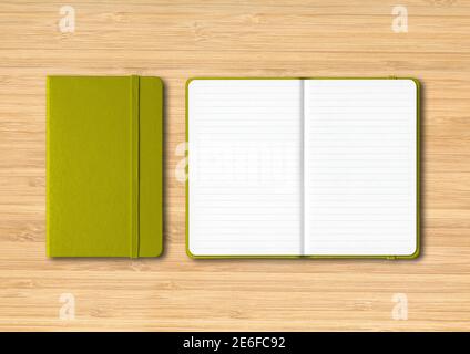 Olive green closed and open lined notebooks mockup isolated on wooden background Stock Photo