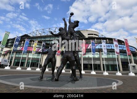 A statue of rugby players reaching for the ball is seen outside Twickenham rugby stadium in west London September 17, 2015. The eight metre bronze sculpture created was created by artist Gerald Laing in 2010. The Rugby Union World Cup begins in Britain on Friday, with both the opening game and ceremony and final taking place at Twickenham.  REUTERS/Toby Melville