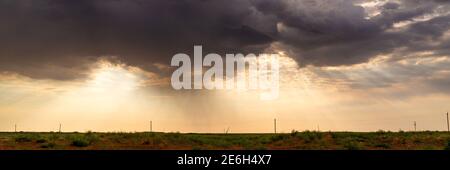 Dramatic stormy sky in desert before thunderstorm. Stock Photo