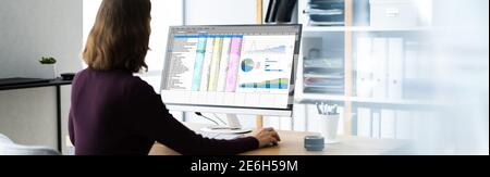 Electronic Spreadsheet Reports On Analyst Computer Screen Stock Photo