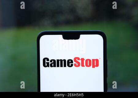 GameStock logo on the smartphone screen and blurred background. Stafford, United Kingdom - January 27 2021 Stock Photo