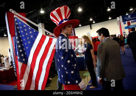 A man dressed as Uncle Sam walks at the Conservative Political Action Conference (CPAC) in National Harbor, Maryland, U.S. February 24, 2017. REUTERS/Joshua Roberts