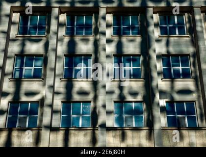 Shadows on building, cast shadows, light pattern, reflection, reflections, building facade, building wall, light and shadows wall Stock Photo