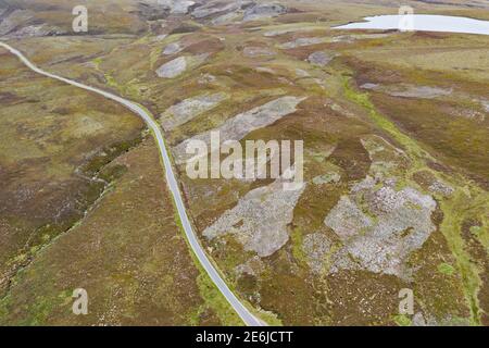 Moorland hillside showing patchwork of burnt areas to encourage young heather shoots for Red Grouse on shooting estate at Lochindorb, Speyside, Scotla Stock Photo