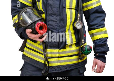Full protective breathing mask in hand of unrecognized firefighter Stock Photo