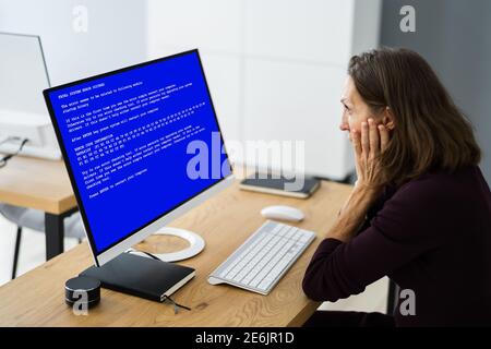 Blue BSOD Error At Computer. Malware Attack Stock Photo