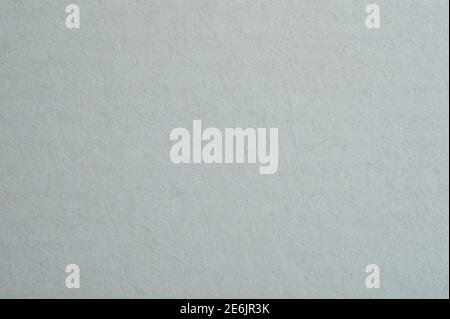 Grey rough paper background macro close up view Stock Photo
