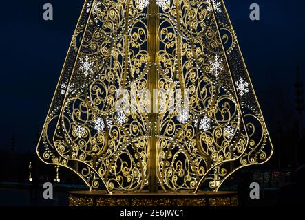 Moscow, Russia - November 29, 2020: Beautiful openwork christmas tree close up in VDNKH park, evening photo Stock Photo