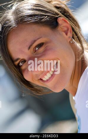 Candid portrait of attractive smiling brunette with no filters. Autentic people concept without artificial filters. Stock Photo