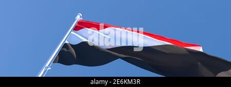 3D rendering of the national flag of Yemen waving in the wind Stock Photo