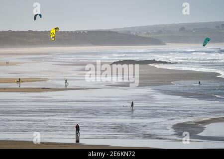 Kite surfers at Upton Towans Beach near Gwithian, Cornwall. Picture date: Friday January 29, 2021. Stock Photo