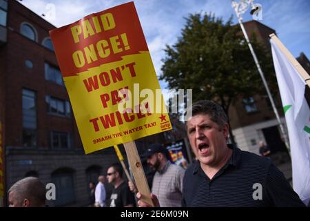 Demonstrators take part in a protest against household water charges, as they urge the Irish Government to accept the European Commission's Apple tax ruling of 13 billion euros ($14.6 billion) in back taxes, in Dublin, Ireland September 17, 2016.  REUTERS/Clodagh Kilcoyne
