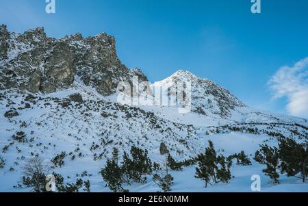 Beautiful winter mountain landscape in the Tatra Mountains. Mountains in the clouds. Mountains in the winter. View of the peaks Stock Photo