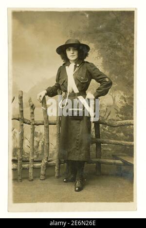 Original WW1 era postcard of attractive early girl guide in uniform with badges, hat, whistle and scarf, from Rochdale in Greater Manchester, England, U.K, circa 1918 Stock Photo