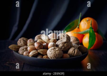Mixed unshelled nuts with texture overlay Stock Photo