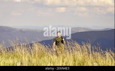 State border guard service. Man with weapon military clothes in field nature background. Army forces. Protecting borders of motherland. Stop illegal immigrants. Guard the borders. Soldier with rifle. Stock Photo