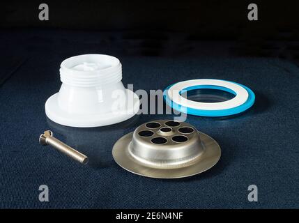 The Plastic siphon for sink on black background.Spare details for repair of the sink Stock Photo