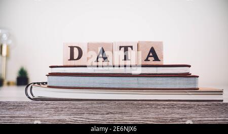 Word DATA on wooden cubes over bright background with copy space Stock Photo