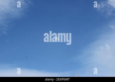 lunar eclipse during the day with a clear sky. minimalist natural footage concept. photo for graphic or astrology content. view of a clear, cloudy sky Stock Photo