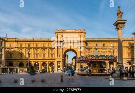 Panoramic view of the city square Piazza della Repubblica in Florence with the porticos, the triumphal arch called the Arcone and the Column of... Stock Photo