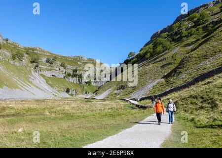 Footpath leading towards Gordale Scar near Malham in the Yorkshire Dales on a sunny summer day Stock Photo